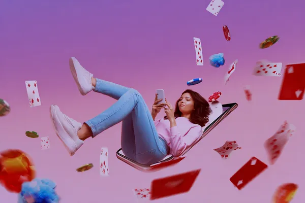 A young woman relaxing with her phone while dynamic casino elements float around her, illustrating the smooth mobile experience offered by the TTTJILI app.