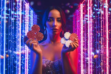 A cheerful woman in traditional clothing using her smartphone during a festive moment, showing how easily the TTTJILI app fits into everyday life.