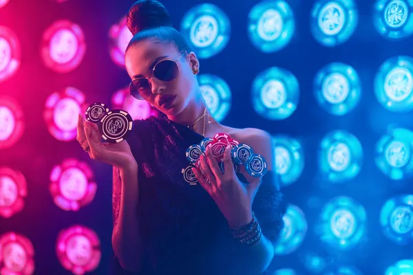 A man focused on his laptop with live stats in the background, highlighting the dedicated sports and gaming features of the TTTJILI mobile app.