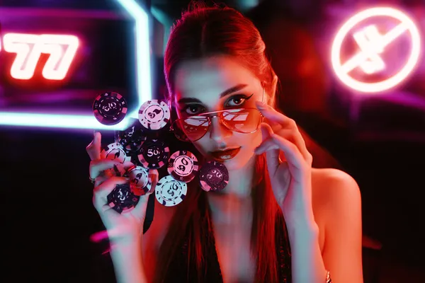 A close-up shot of golden coins falling around a spinning roulette wheel, representing immersive casino action at TTTJILI.
