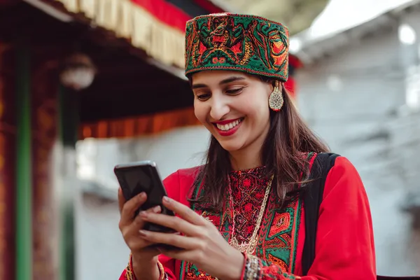 A person using their device against a moody casino-themed background, illustrating the smooth re-entry process at TTTJILI.
